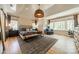 Spacious main bedroom with hardwood floors, decorative ceiling, large rug, bench and large windows at 410 Mcalway Rd, Charlotte, NC 28211