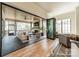 Inviting screened-in porch with comfortable seating, a fireplace, and a television, perfect for outdoor living at 410 Mcalway Rd, Charlotte, NC 28211