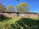 Charming single-story brick home with a well-manicured front yard and mature trees, providing ample shade and curb appeal at 4230 Old Brittain Rd, Hickory, NC 28602