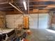 Attached garage features two overhead doors, high ceilings, and exposed beams at 4230 Old Brittain Rd, Hickory, NC 28602