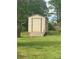 Exterior view of a metal shed in a grassy backyard surrounded by trees at 4230 Old Brittain Rd, Hickory, NC 28602