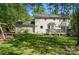 Spacious backyard featuring a deck, swing set, and lush greenery at 505 Southland Rd, Huntersville, NC 28078