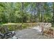 Wooden deck with patio seating overlooking expansive backyard with shed and mature trees at 505 Southland Rd, Huntersville, NC 28078