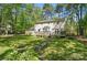 Backyard featuring an expansive yard, wooden deck, and a bird bath feature at 505 Southland Rd, Huntersville, NC 28078