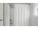 Clean white shower with shower curtain and faucet, ideal for a refreshing experience at 505 Southland Rd, Huntersville, NC 28078