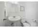 Clean half-bath with pedestal sink, standard toilet, and bright white walls at 505 Southland Rd, Huntersville, NC 28078