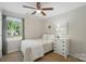 Cozy bedroom with natural light, neutral color palette, and comfortable furnishings provides a serene atmosphere at 505 Southland Rd, Huntersville, NC 28078