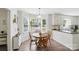 Bright dining area featuring a round table beneath big windows and modern finishes at 505 Southland Rd, Huntersville, NC 28078