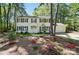 Beautiful two-story home boasting a bright facade, dark shutters, and lush landscaping, creating an inviting curb appeal at 505 Southland Rd, Huntersville, NC 28078