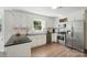 Well-lit kitchen with stainless steel appliances and dark countertops at 505 Southland Rd, Huntersville, NC 28078