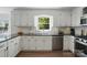 Modern kitchen with sleek black countertops and stainless steel appliances at 505 Southland Rd, Huntersville, NC 28078