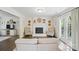 Cozy living room features a brick fireplace, hardwood floors, and french doors leading to the backyard at 505 Southland Rd, Huntersville, NC 28078