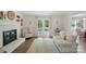 Stylish living room with hardwood floors, a fireplace, and french doors offers a bright and inviting space at 505 Southland Rd, Huntersville, NC 28078