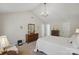 Another view of the main bedroom featuring vaulted ceilings, an elegant chandelier, and tasteful decor at 505 Southland Rd, Huntersville, NC 28078