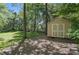 A backyard shed offering extra storage and features a neutral paint color and double doors at 505 Southland Rd, Huntersville, NC 28078