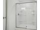 Modern shower with glass doors and built-in shelves, offering a clean and functional design at 505 Southland Rd, Huntersville, NC 28078