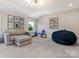 Large basement featuring comfortable seating, a beanbag chair, and play area at 5078 Hyannis Ct, Matthews, NC 28104