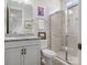 Bathroom with a granite countertop, glass shower, white subway tile, and a modern vanity at 5078 Hyannis Ct, Matthews, NC 28104