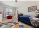 Comfortable bedroom with a window, colorful rug, and fun decor at 5078 Hyannis Ct, Matthews, NC 28104