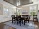 Elegant dining room featuring a stylish chandelier and plenty of natural light at 5078 Hyannis Ct, Matthews, NC 28104