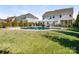 Backyard featuring a beautiful pool with outdoor furniture, great for relaxing and entertaining guests at 5078 Hyannis Ct, Matthews, NC 28104
