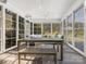 Charming sunroom filled with windows and natural light, perfect for relaxation at 5078 Hyannis Ct, Matthews, NC 28104