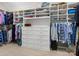 Spacious walk-in closet with custom shelving, drawers, and ample storage space at 5078 Hyannis Ct, Matthews, NC 28104