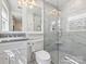 Tastefully designed bathroom with modern fixtures, a glass-enclosed shower, and vanity storage at 517 Wingrave Dr, Charlotte, NC 28270