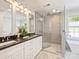 Elegant bathroom featuring double vanity sinks and a large glass-enclosed shower at 517 Wingrave Dr, Charlotte, NC 28270