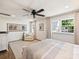 Bright bedroom with a ceiling fan, hardwood floors and a nice seating area at 517 Wingrave Dr, Charlotte, NC 28270