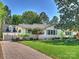 Charming single story home featuring lush lawn, tidy landscaping and brick driveway at 517 Wingrave Dr, Charlotte, NC 28270