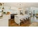 Updated kitchen featuring a large island, stainless appliances, and hardwood floors at 517 Wingrave Dr, Charlotte, NC 28270