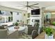 Open concept living room featuring large windows, neutral colors, and a fireplace at 517 Wingrave Dr, Charlotte, NC 28270