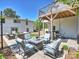 Cozy outdoor patio with a seating area, fire pit, and covered deck provides a relaxing retreat at 517 Wingrave Dr, Charlotte, NC 28270