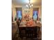 Formal dining room with chandelier, decorative rug, and elegant decor at 5228 Sunriver Rd, Gastonia, NC 28054