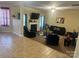 Bright living room featuring a fireplace, television, and wood-look floors at 5228 Sunriver Rd, Gastonia, NC 28054