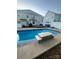 Inviting backyard pool with stone feature, patio, and fenced yard at 5228 Sunriver Rd, Gastonia, NC 28054