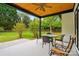 Relaxing back porch with ceiling fan and backyard views at 530 Dovefield Dr, Indian Trail, NC 28079