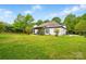 Expansive backyard featuring a well-manicured lawn and rear view of the house at 530 Dovefield Dr, Indian Trail, NC 28079