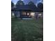 A spacious backyard featuring a covered patio and a well-maintained lawn, perfect for outdoor gatherings at 530 Dovefield Dr, Indian Trail, NC 28079