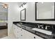 Bathroom featuring double vanity, black marble countertop, and modern fixtures at 530 Dovefield Dr, Indian Trail, NC 28079