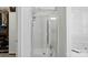 Bathroom with a glass-door shower and storage shelving at 530 Dovefield Dr, Indian Trail, NC 28079