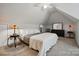 Bedroom with ceiling fan, carpet floors, side tables, and a vaulted ceiling at 530 Dovefield Dr, Indian Trail, NC 28079