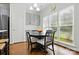 Cozy dining area featuring a round table, bright window, and stylish pendant lighting at 530 Dovefield Dr, Indian Trail, NC 28079
