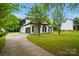 Classic two-story home with attached garage and ample parking space, situated on large lot at 530 Dovefield Dr, Indian Trail, NC 28079
