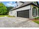 Spacious two-car garage with dark brown door, ample driveway space, and clean exterior at 530 Dovefield Dr, Indian Trail, NC 28079