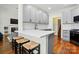 Bright eat-in kitchen with stainless steel appliances, gray cabinets and a quartz countertop bar at 530 Dovefield Dr, Indian Trail, NC 28079