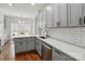 Charming kitchen with gray cabinets, white countertops, subway tile backsplash and stainless steel appliances at 530 Dovefield Dr, Indian Trail, NC 28079
