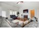Inviting living room with high ceilings, fireplace, and natural light shining through windows at 530 Dovefield Dr, Indian Trail, NC 28079