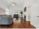 Bright living room featuring tall ceilings, fireplace, hardwood floors, and comfortable furnishings at 530 Dovefield Dr, Indian Trail, NC 28079